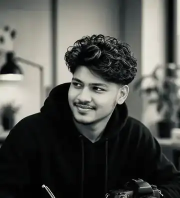 Shakil Mir in studio, black hoodie